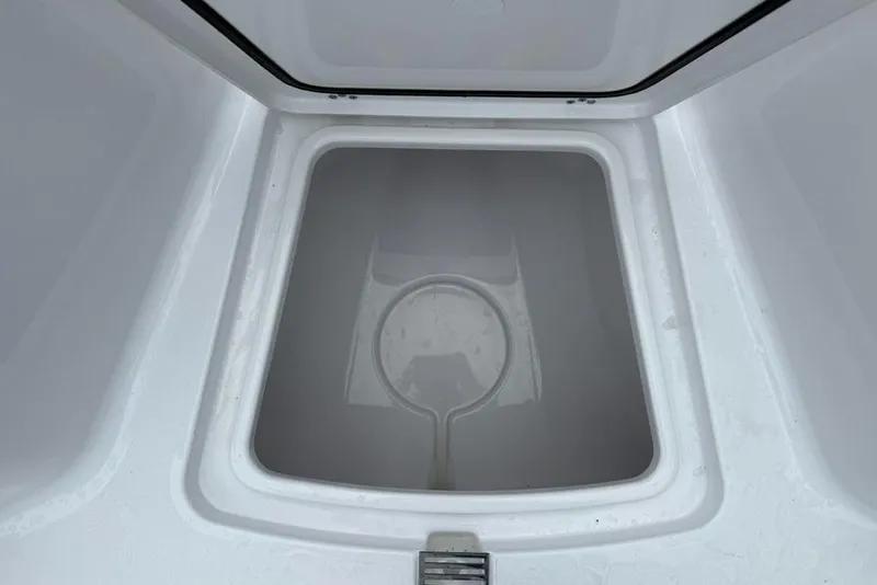 Slide: The Image of Storage compartment of 2026 Sportsman Open 212 Center Console boat, interior view. - 16