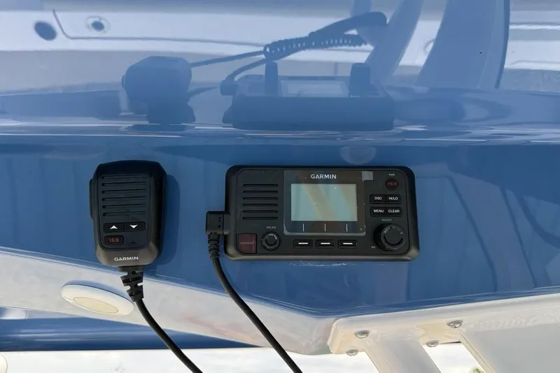 Slide: The Image of Garmin marine radio on 2026 Sportsman Open 212 Center Console boat dashboard. - 19