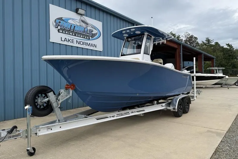 Slide: The Image of 2026 Sportsman Open 212 Center Console boat on trailer at Foothills Marine Center. - 2