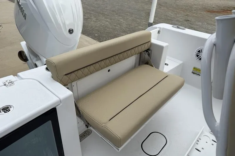 Slide: The Image of 2026 Sportsman Open 212 Center Console boat with beige seating and Yamaha engine. - 20