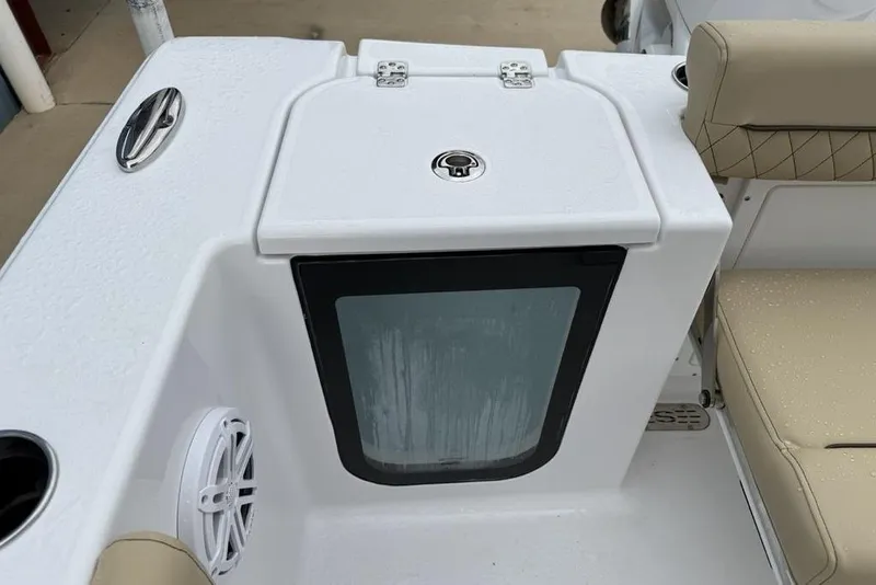 Slide: The Image of 2026 Sportsman Open 212 Center Console boat interior with storage compartment and seating. - 22