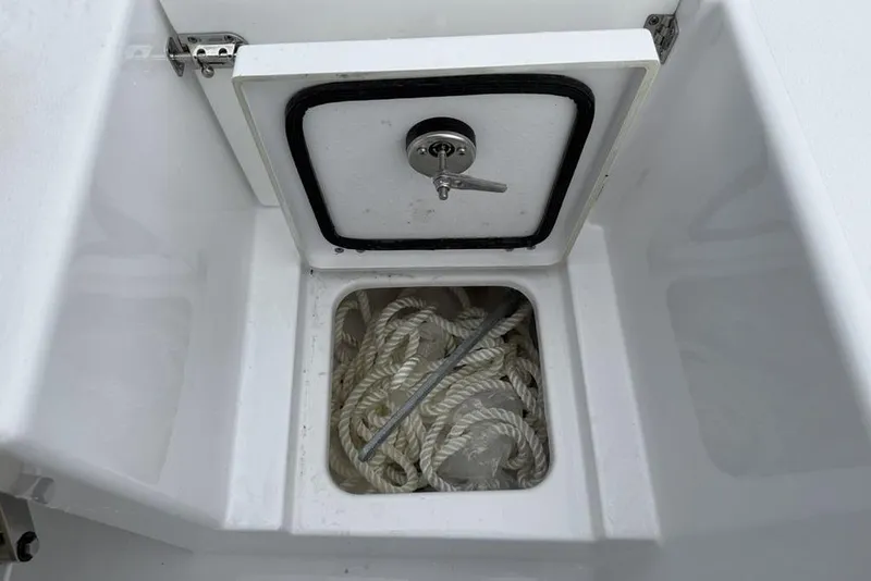Slide: The Image of Storage compartment with rope in 2026 Sportsman Open 212 Center Console boat. - 23