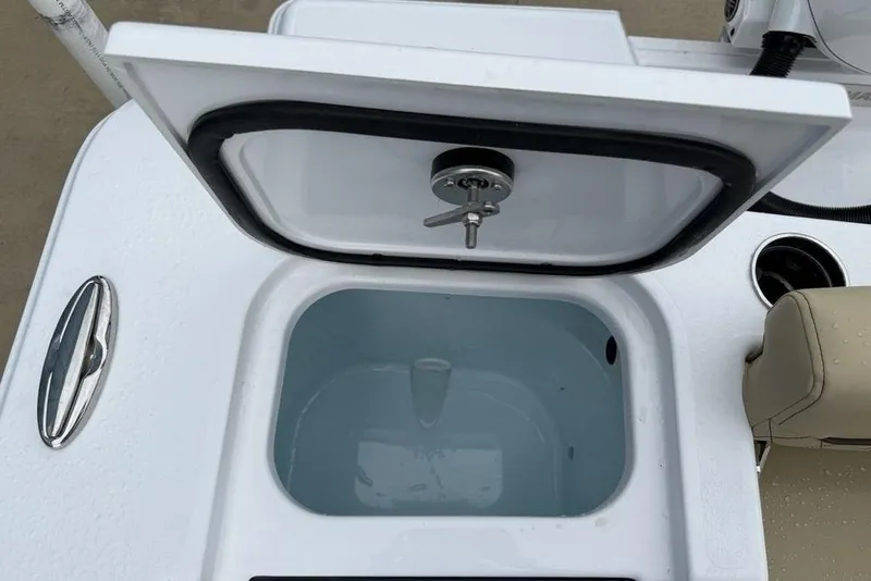Slide: The Image of 2026 Sportsman Open 212 Center Console livewell with open lid and seating detail. - 25