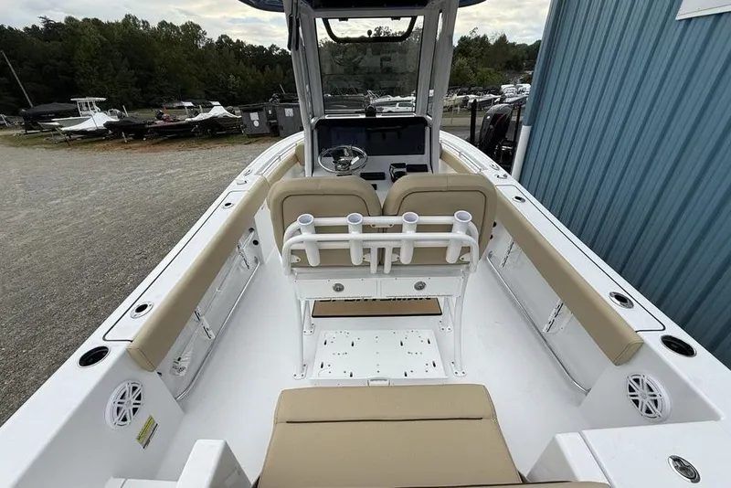 Slide: The Image of 2026 Sportsman Open 212 Center Console boat with beige seating and modern design. - 26