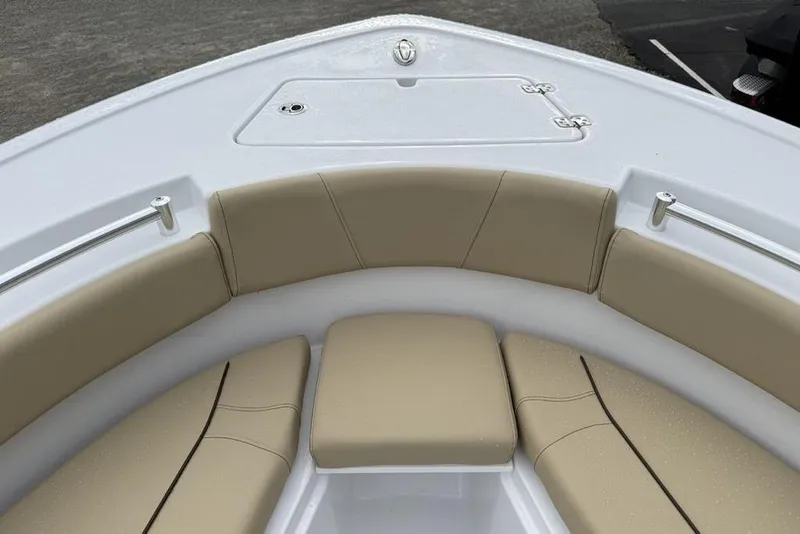 Slide: The Image of 2026 Sportsman Open 212 Center Console boat with beige cushioned seating. - 5