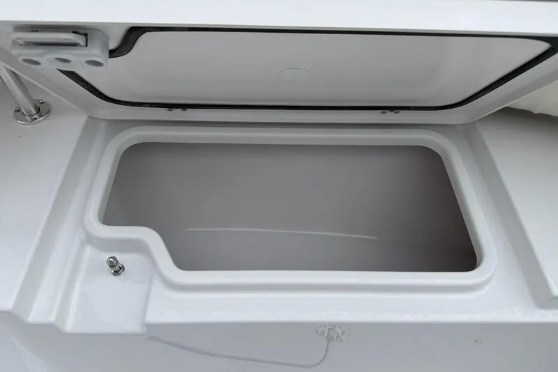 Slide: The Image of Open storage compartment on 2026 Sportsman Open 212 Center Console boat. - 6