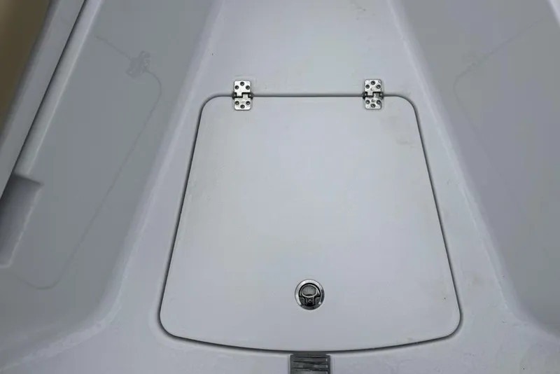 Slide: The Image of 2026 Sportsman Open 212 Center Console storage compartment with secure latch and hinges. - 9