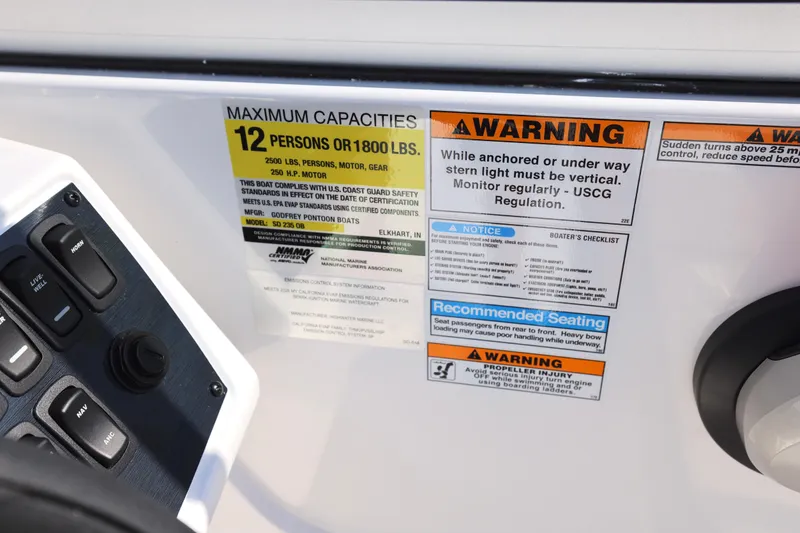 Slide: The Image of 2026 Hurricane SunDeck 235 OB boat interior with spacious seating and modern design. - 7