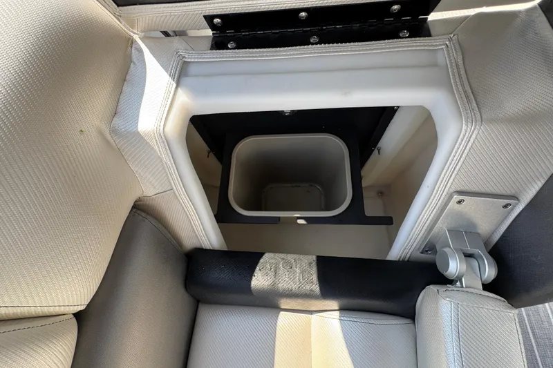 Slide: The Image of 2022 South Bay 25 Sport CR9-DC boat seat storage compartment with integrated bin. - 20