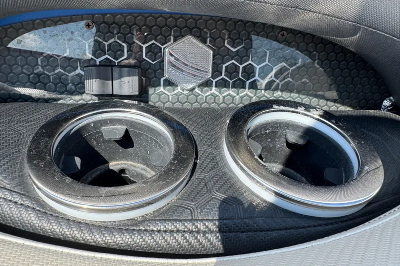 Slide: The Image of Close-up of 2022 South Bay 25 Sport CR9-DC boat cup holders and textured panel. - 21