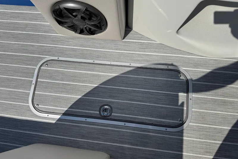 Slide: The Image of 2022 South Bay 25 Sport CR9-DC boat deck with speaker and storage hatch. - 23