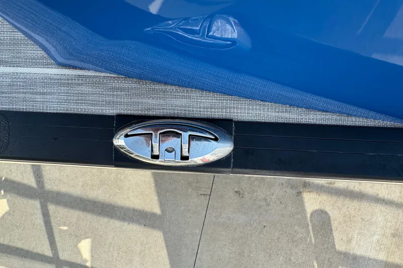 Slide: The Image of 2022 South Bay 25 Sport CR9-DC boat detail with blue and gray fabric cover. - 25