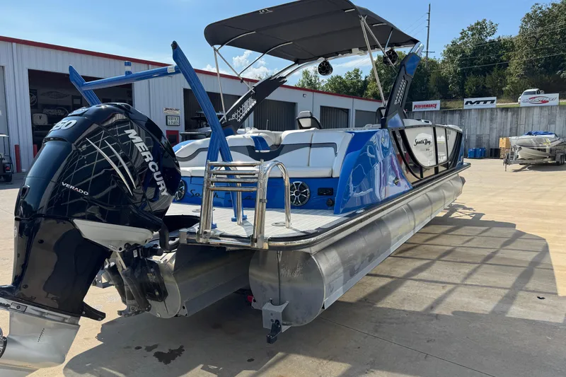 Slide: The Image of 2022 South Bay 25 Sport CR9-DC pontoon boat with Mercury Verado engine, docked outdoors. - 5
