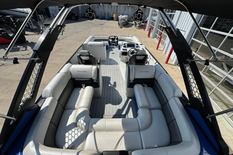 Slide: The Image of 2022 South Bay 25 Sport CR9-DC pontoon boat with spacious seating and modern design. - 9