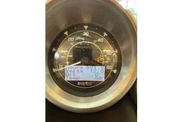 Slide: The Image of 2012 MasterCraft X25 speedometer displaying hours, volts, oil, and temperature readings. - 15
