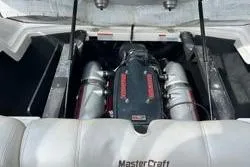 Slide: The Image of 2012 MasterCraft X25 engine compartment with visible components and branding. - 4