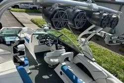 Slide: The Image of 2012 MasterCraft X25 boat interior with speakers and seating, showcasing luxury and design. - 7