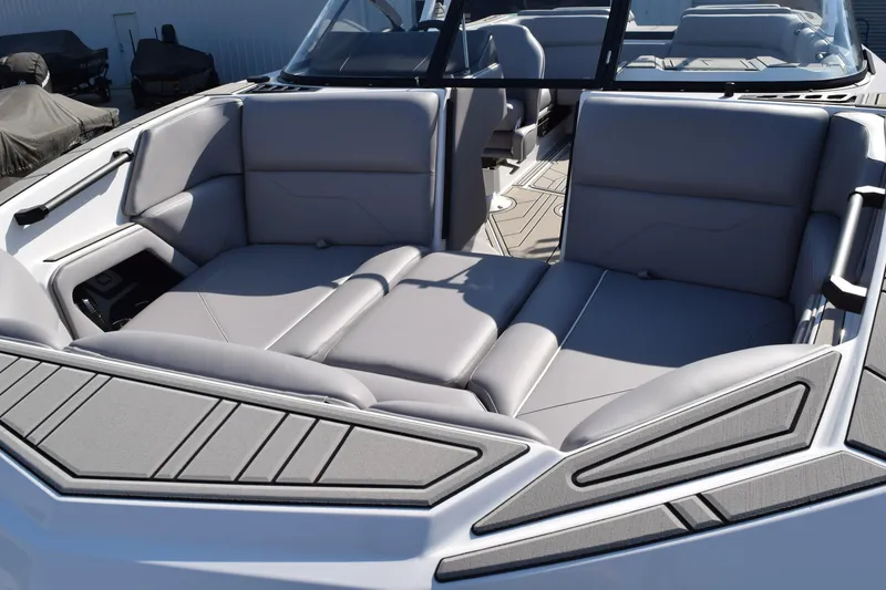 Slide: The Image of 2026 Moomba Max boat interior with sleek gray seating and modern design. - 6