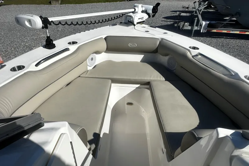 Slide: The Image of 2023 Key West 239 DFS boat interior with cushioned seating and modern design. - 10