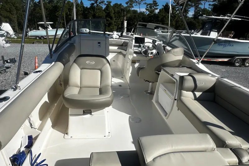 Slide: The Image of 2023 Key West 239 DFS boat interior with seating and steering console. - 4