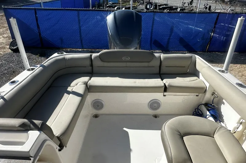 Slide: The Image of 2023 Key West 239 DFS boat interior with cushioned seating and storage. - 5