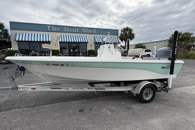 Slide: The Image of 2015 NauticStar 1910 NauticBay boat on trailer outside The Boat Shed. - 1