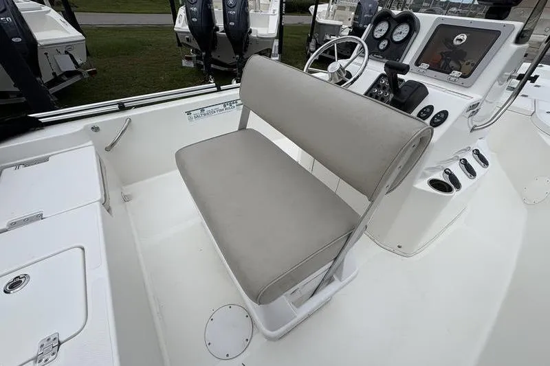 Slide: The Image of 2015 NauticStar 1910 NauticBay boat interior with steering console and cushioned seating. - 15