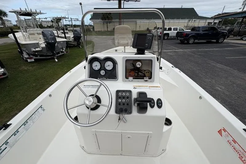 Slide: The Image of 2015 NauticStar 1910 NauticBay boat dashboard with steering wheel and gauges. - 18