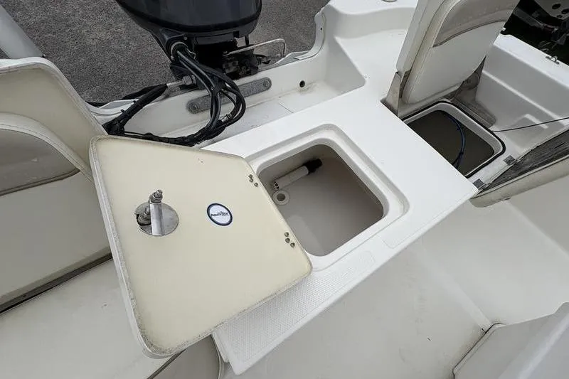 Slide: The Image of 2015 NauticStar 1910 NauticBay boat interior with open storage compartment. - 2