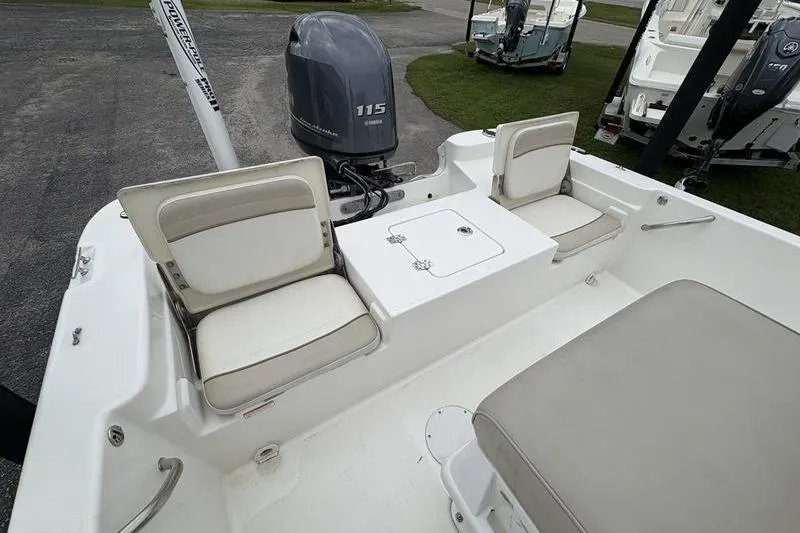 Slide: The Image of 2015 NauticStar 1910 NauticBay boat interior with seating and outboard motor. - 21