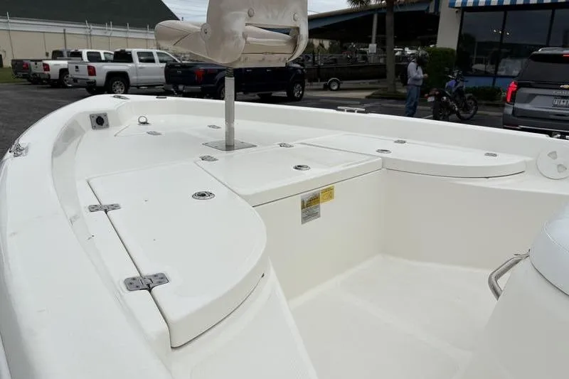 Slide: The Image of 2015 NauticStar 1910 NauticBay boat interior with seating and storage compartments. - 3
