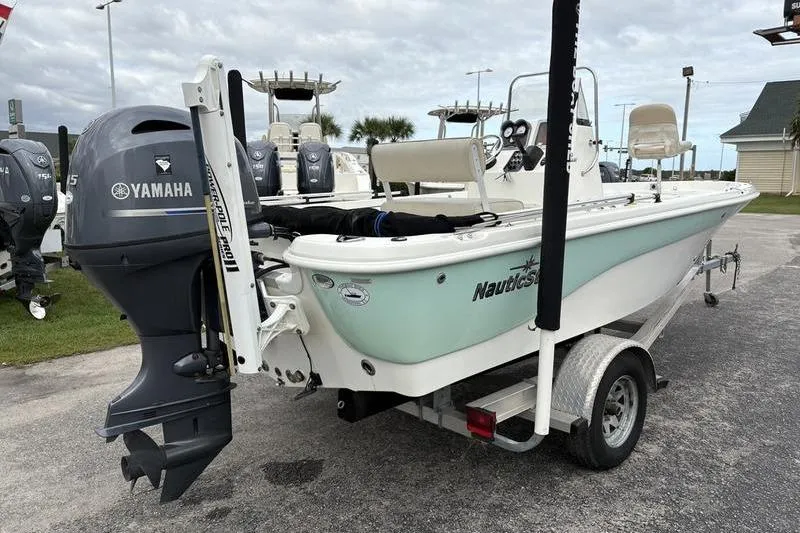 Slide: The Image of 2015 NauticStar 1910 NauticBay boat on trailer with Yamaha outboard motor. - 4