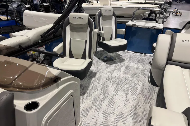 Slide: The Image of 2026 Sylvan Mirage X X3 Party Fish boat interior with plush seating and modern design. - 11
