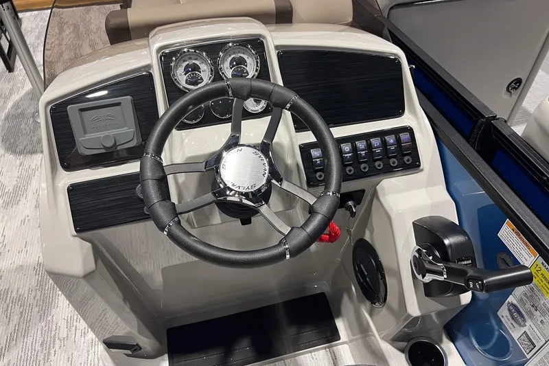 Slide: The Image of 2026 Sylvan Mirage X X3 Party Fish boat dashboard with steering wheel and control panel. - 13