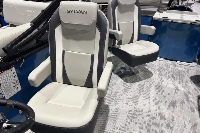 Slide: The Image of 2026 Sylvan Mirage X X3 Party Fish boat interior with plush seating and modern design. - 14