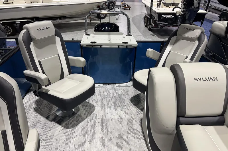 Slide: The Image of 2026 Sylvan Mirage X X3 Party Fish boat interior with plush seating and modern design. - 17