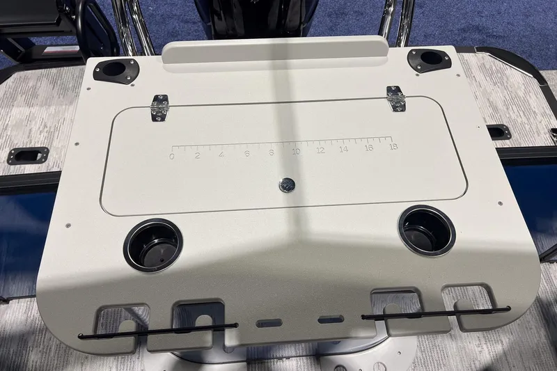 Slide: The Image of Fishing station on 2026 Sylvan Mirage X X3 Party Fish boat, featuring cup holders and measurement guide. - 21