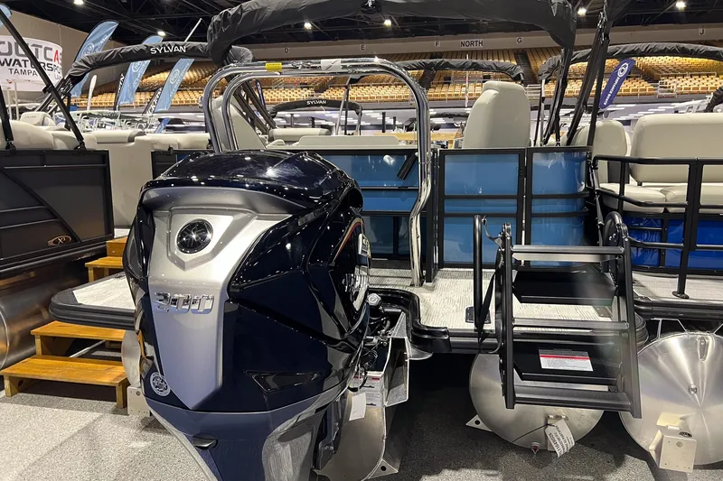 Slide: The Image of 2026 Sylvan Mirage X X3 Party Fish pontoon boat with powerful outboard motor. - 3
