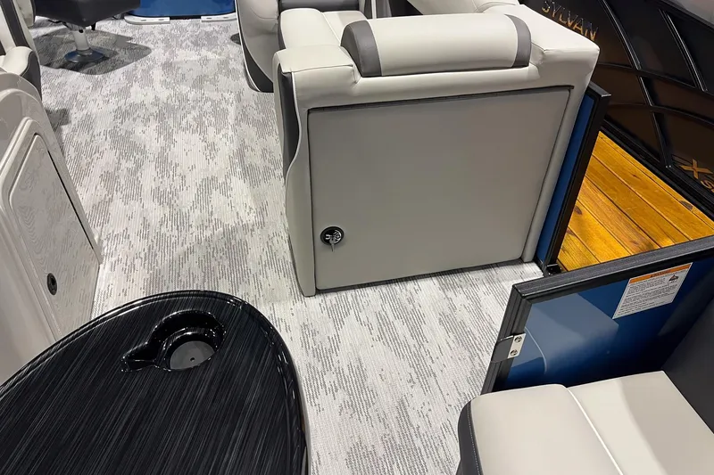 Slide: The Image of 2026 Sylvan Mirage X X3 Party Fish interior with sleek seating and modern design. - 9