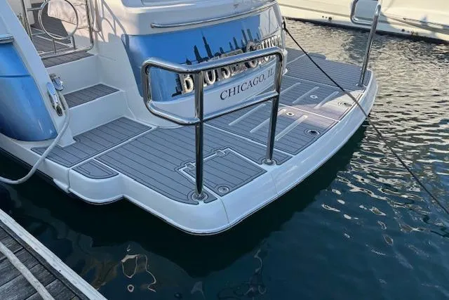 Slide: The Image of 2020 Riviera 4800 Sport Yacht docked in Chicago marina. - 31