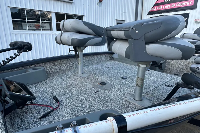 Slide: The Image of 2014 Tracker Pro Team 175 TF boat interior with swivel seats and fishing equipment. - 12