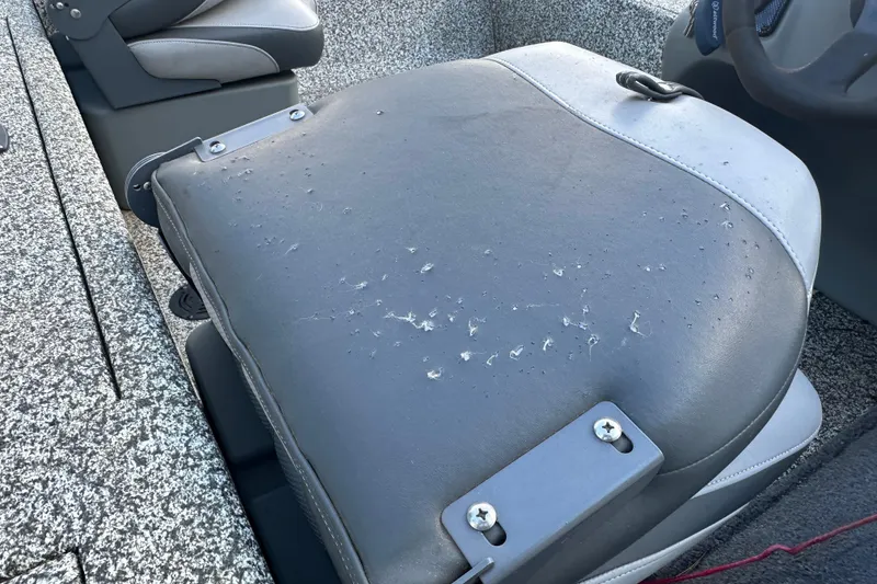 Slide: The Image of Worn seat of 2014 Tracker Pro Team 175 TF boat, showing visible wear and tear. - 17