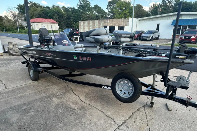 Slide: The Image of 2014 Tracker Pro Team 175 TF fishing boat on trailer, parked outdoors. - 6