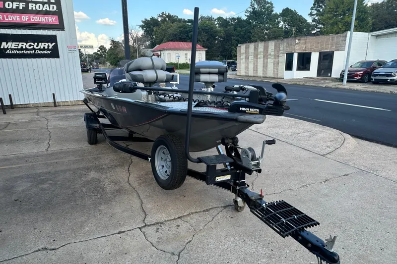 Slide: The Image of 2014 Tracker Pro Team 175 TF fishing boat on trailer, parked outside dealership. - 7