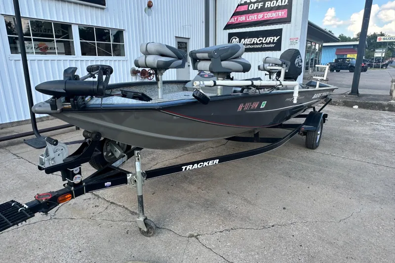 Slide: The Image of 2014 Tracker Pro Team 175 TF fishing boat on trailer, parked outside dealership. - 8