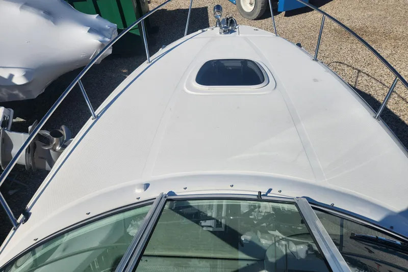 Slide: The Image of Compact bathroom in 2007 Sea Ray 260 Sundancer boat with sink and toilet. - 19