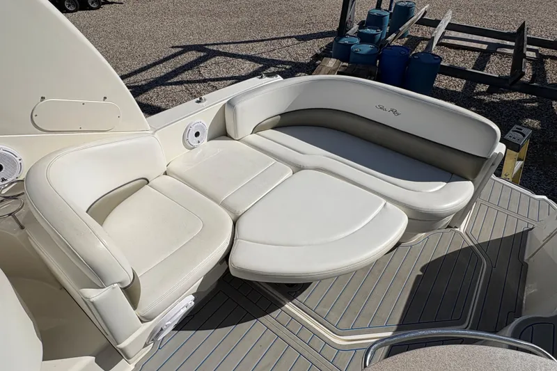 Slide: The Image of 2007 Sea Ray 260 Sundancer boat with white leather seating and deck view. - 5