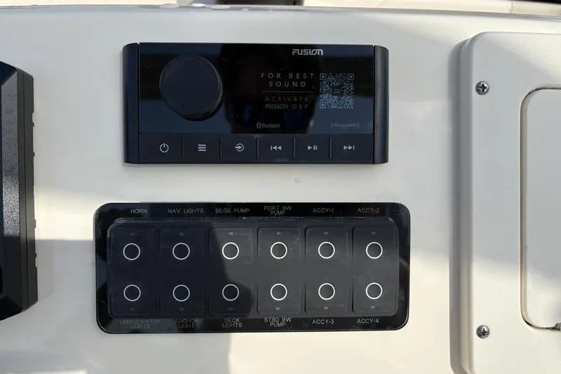 Slide: The Image of Control panel of 2026 Scout 188 Sportfish boat with Fusion audio system. - 15