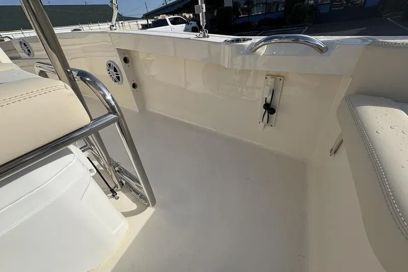 Slide: The Image of 2026 Scout 188 Sportfish boat interior with seating and chrome details. - 20