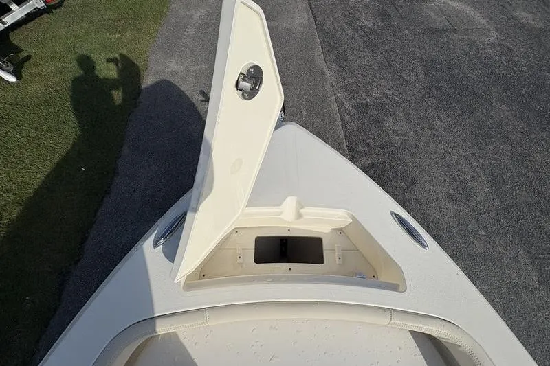 Slide: The Image of 2026 Scout 188 Sportfish boat bow with open storage compartment. - 22